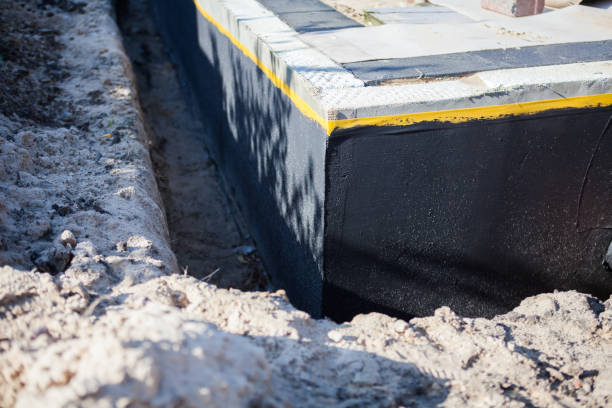Professional Waterproofing technician working in Jenison, MI